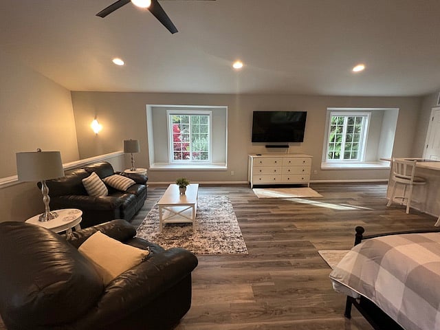 Sitting area with movable large screen TV, large dresser below