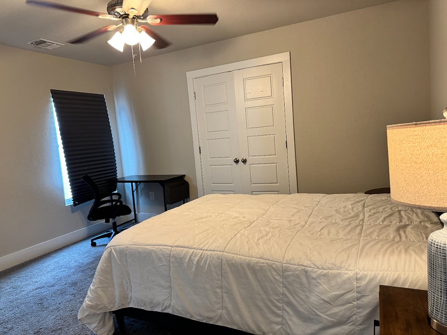 Bedroom 2 features a desk/chair, ensuite bathroom and spacious closet