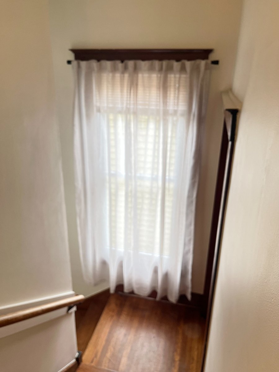 view down the stairs towards the basement laundry (right) or private entrance (left)