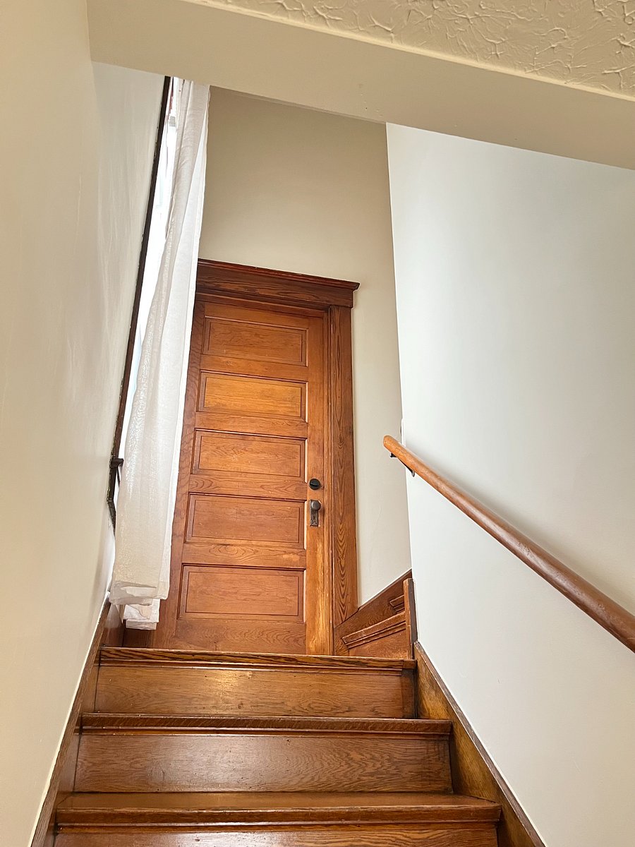 view from private front entrance up steps towards apartment