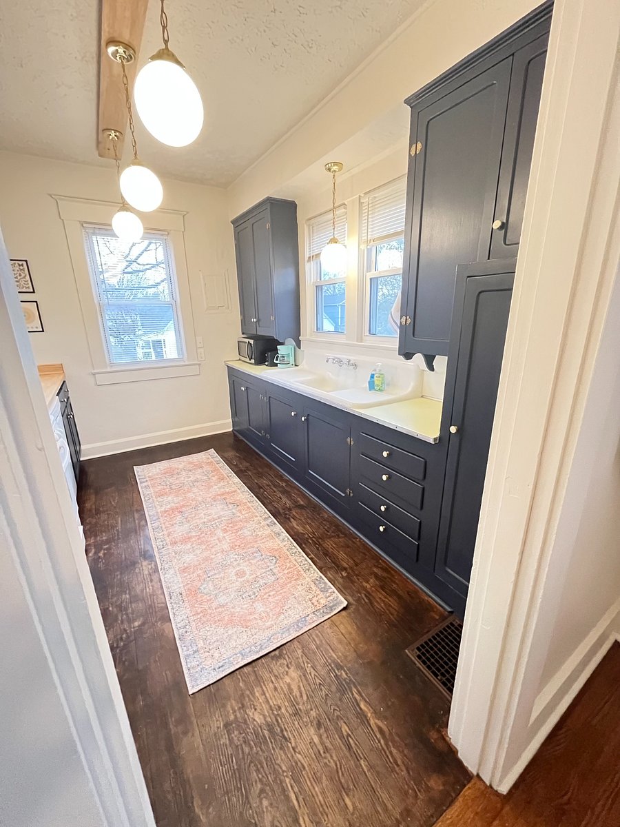 fully restored ORIGINAL kitchen with original sink, cabinets, countertops