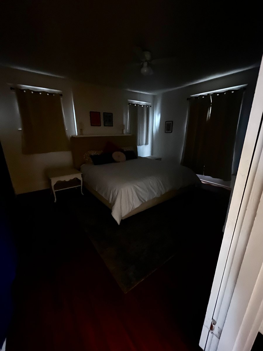 main bedroom with 100% blackout curtains