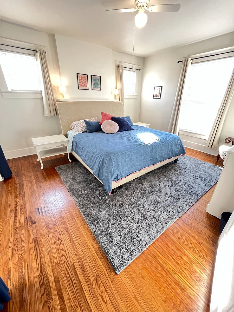 spacious main bedroom with king sized bed