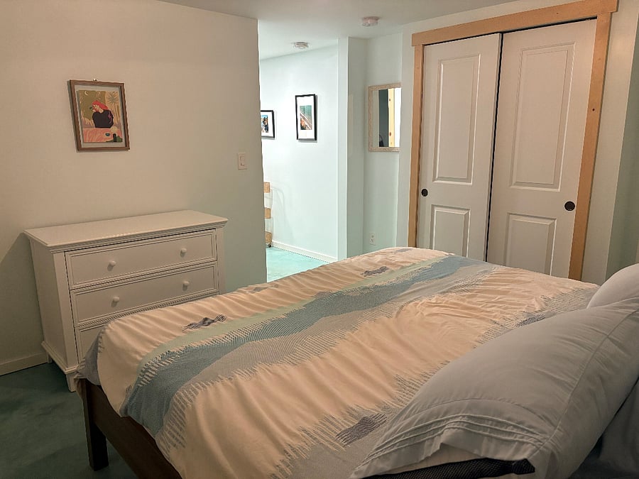 Bedroom showing dresser and closet