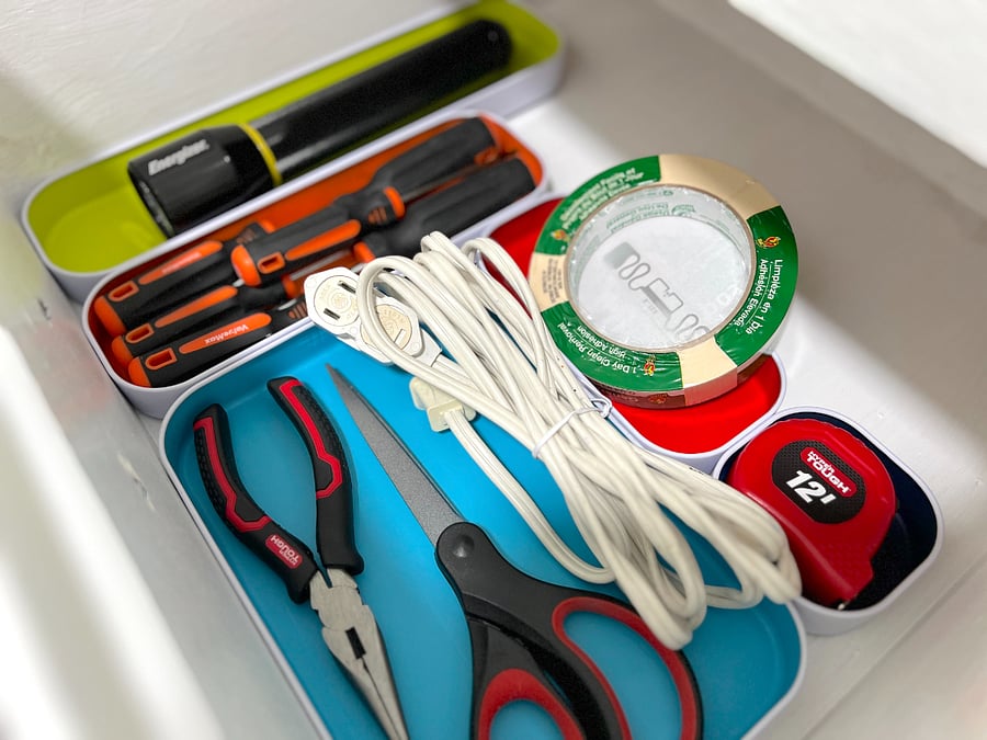 Utility drawer: flashlight, screw driver set, measuring tape, general purpose tape, extension cord, needle nose pliers and scissors