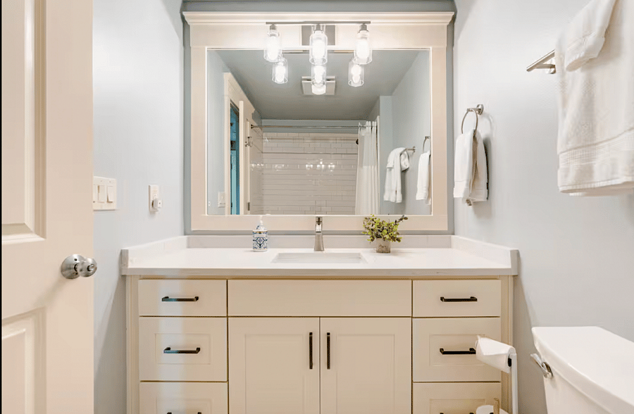 Hallway bathroom with tub and shower