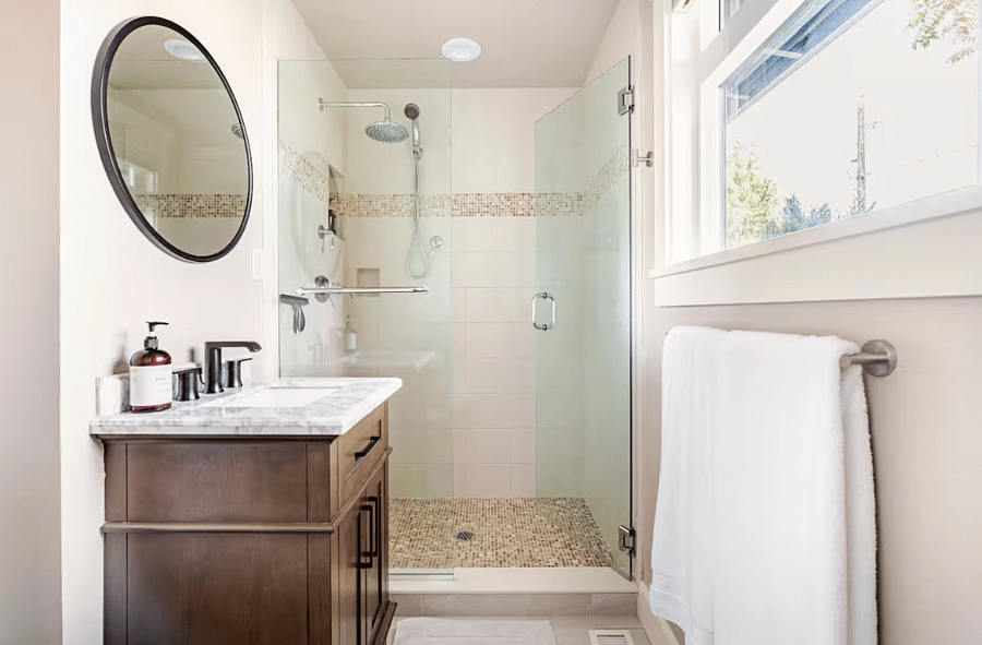 Primary en suite bathroom has a standing shower