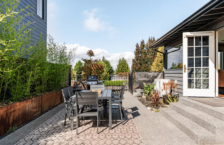 Enjoy peekaboo views of Lake Washington from the Back Patio! Pack patio is lined with custom bamboo planters newly installed in Summer 2025.