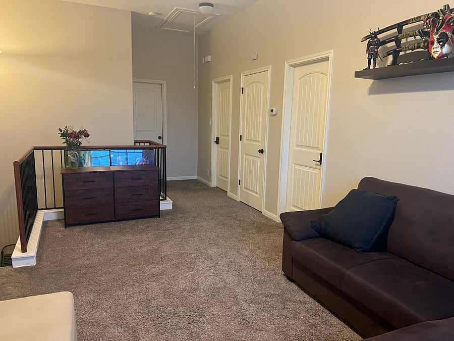Your private, chill-out loft area with workspace and couches.