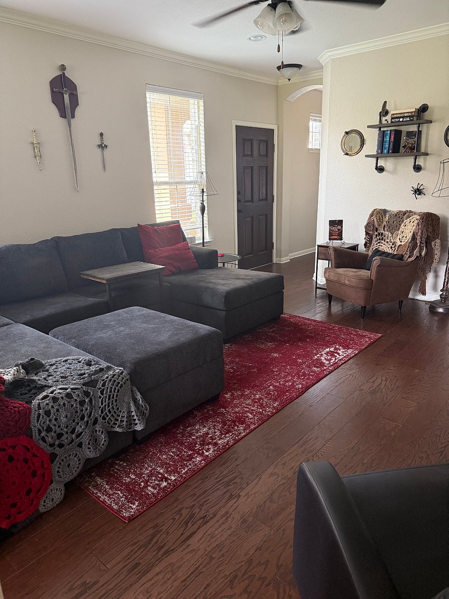 Shared downstairs living space with smart TV, gaming consoles, books and games