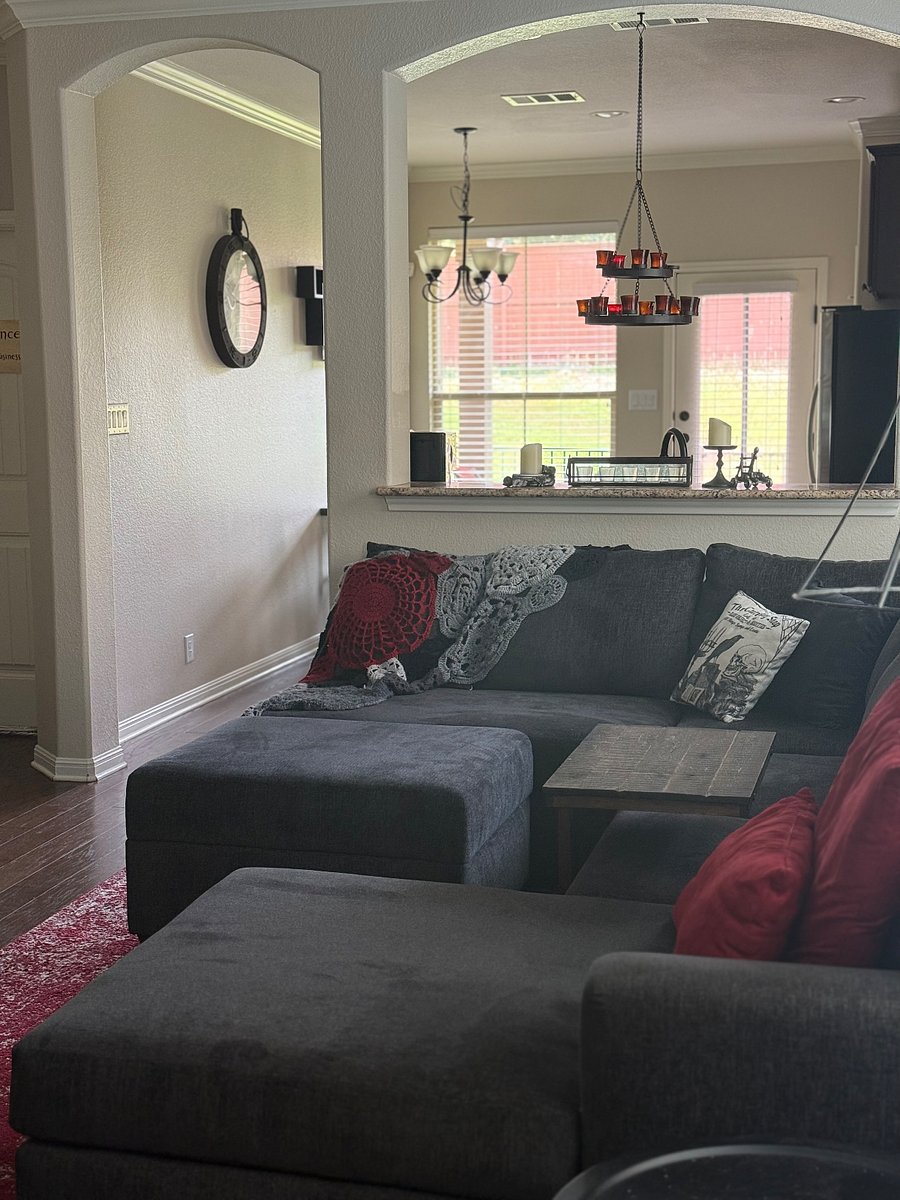 Shared downstairs living space with smart TV, gaming consoles, books and games