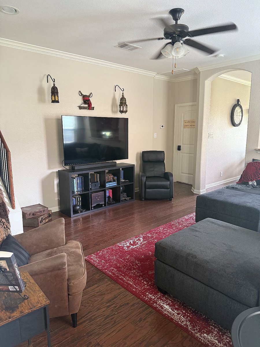 Shared downstairs living space with smart TV, gaming consoles, books and games