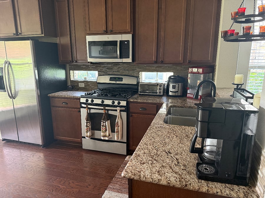 Shared, fully-stocked kitchen with cookware, spices, coffee maker, toaster oven, InstaPot, and utensils