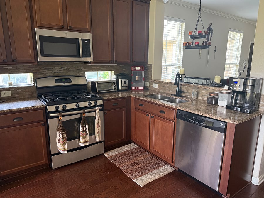 Shared, fully-stocked kitchen with cookware, spices, coffee maker, toaster oven, InstaPot, and utensils