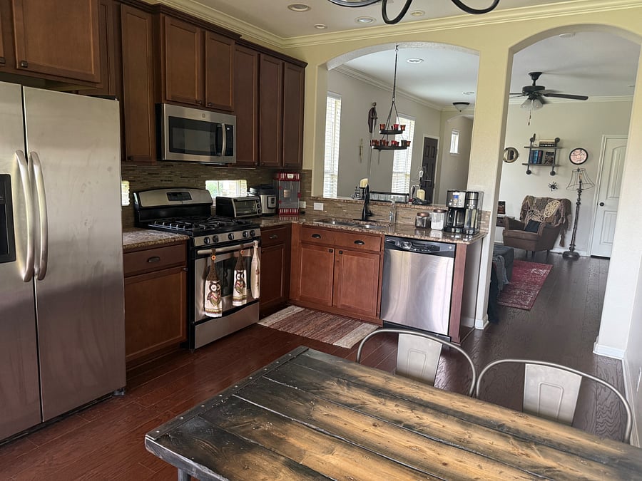 Shared, fully-stocked kitchen with cookware, spices, coffee maker, toaster oven, InstaPot, and dining table