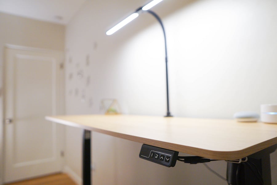 Adjustable standing work desk in the primary room