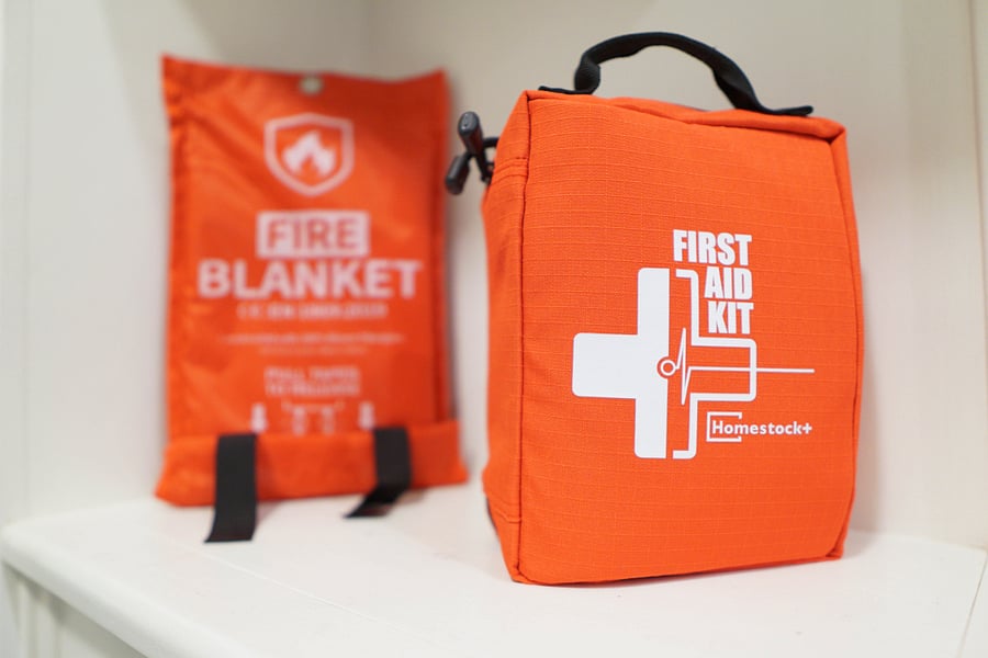 Fire blanket and first aid kit located in the kitchen nook. Safety first!