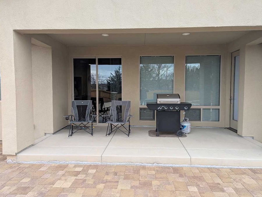COVERED PATIO WITH GAS GRILL & ROCKING CHAIRS
