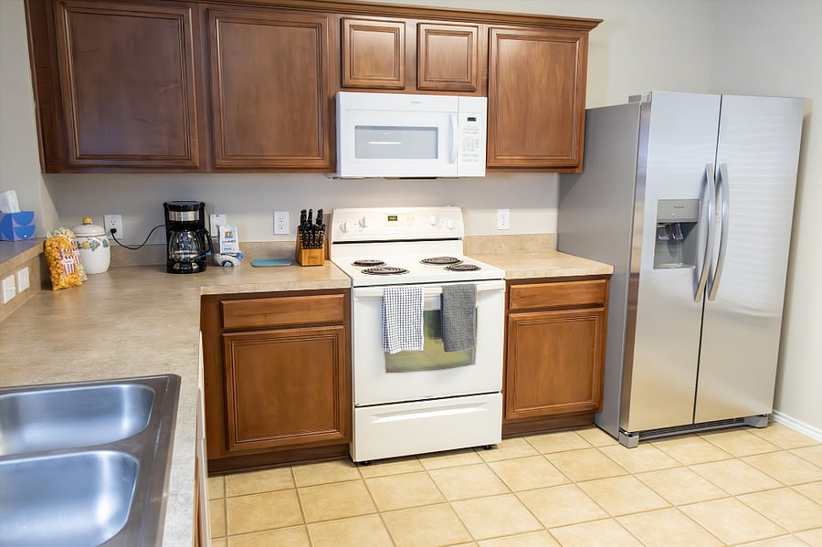 Kitchen is Fully Stocked with Coffee Maker, Dishes, Silverware, and Pots and Pans