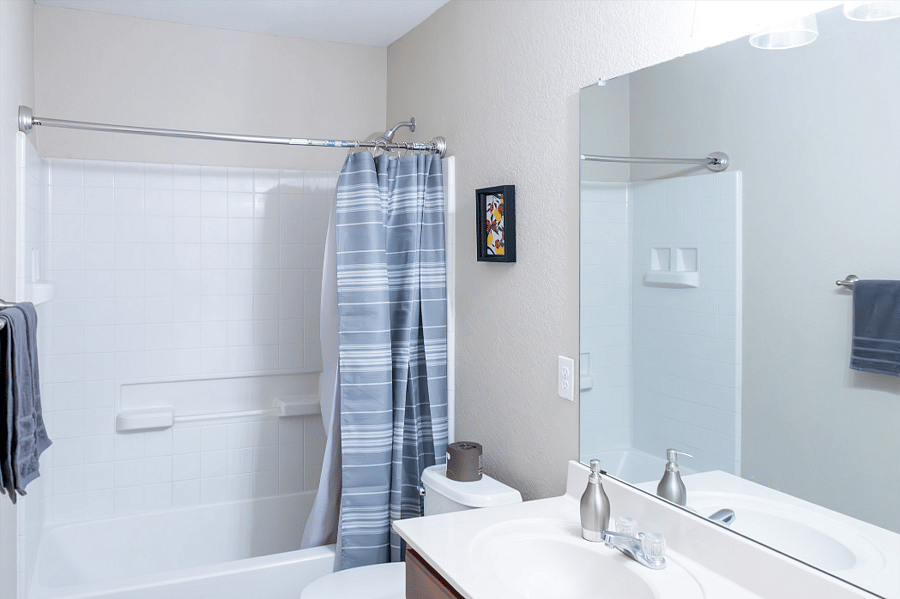 Guest Bathroom Has a Shower, Bathtub, Large Vanity Mirror, Hair Dryer, and Thick Towels