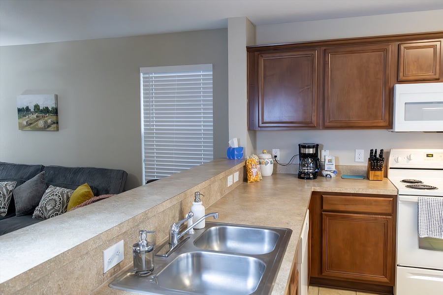 Kitchen Has a Double Stainless-Steel Sink and Comes with a Starter Kit of Cleaning Supplies