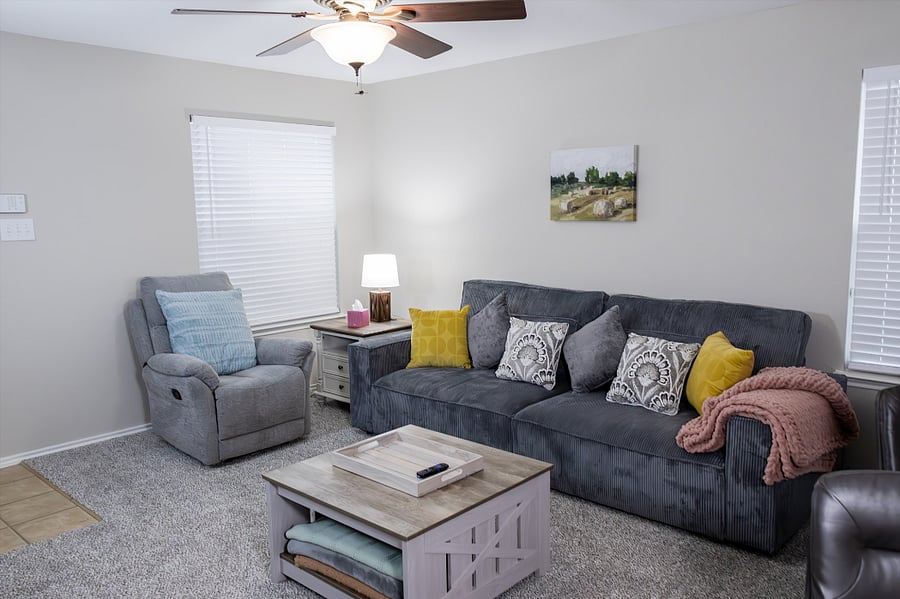 Living Room is Equipped with Plenty of Throw Pillows and Soft Blankets for Added Comfort