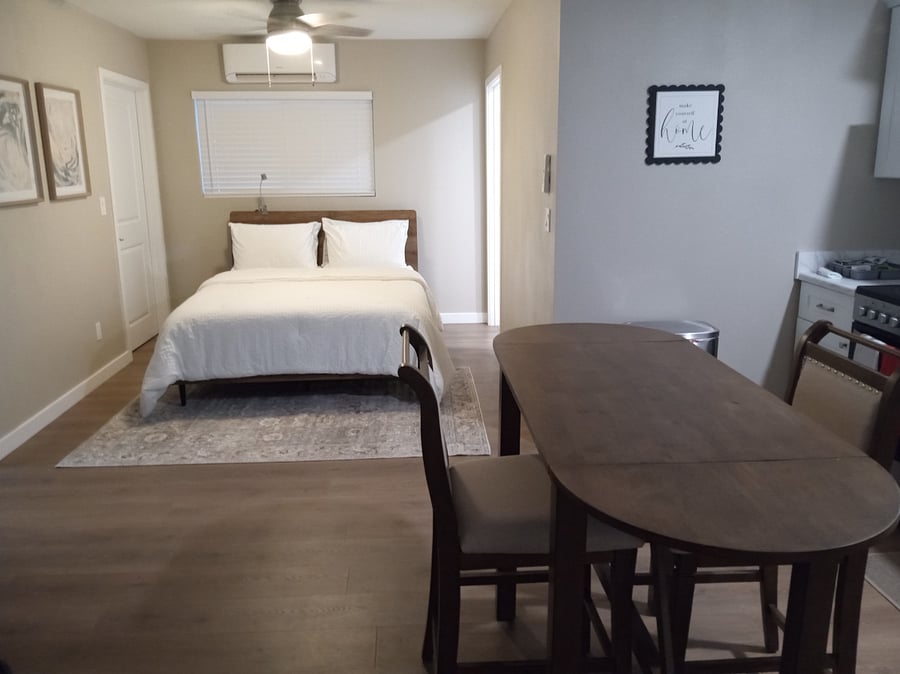 Studio cottage, perfect for one or two individuals. Complete kitchen, table for two, queen sized bed, heater/air conditioner above window, large bathroom/shower on the right, walk in closet on the left.