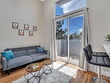 Open concept living room adjacent to kitchen
