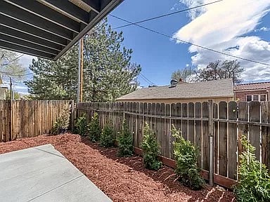 Covered ground floor patio with slider door access.
