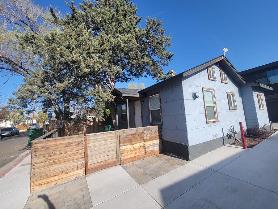 Shaded and fenced front yard.