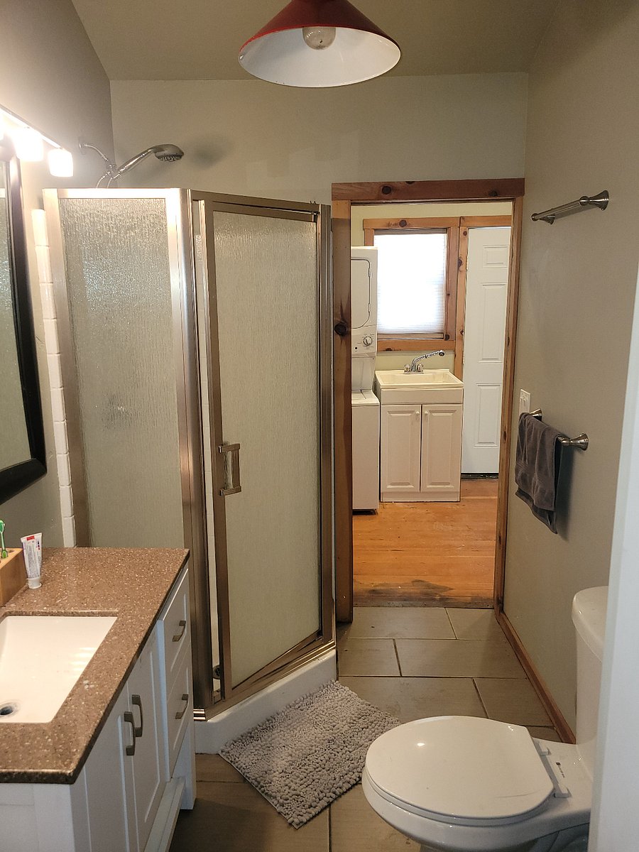 Bathroom is accessible from master and hallway with laundry.
