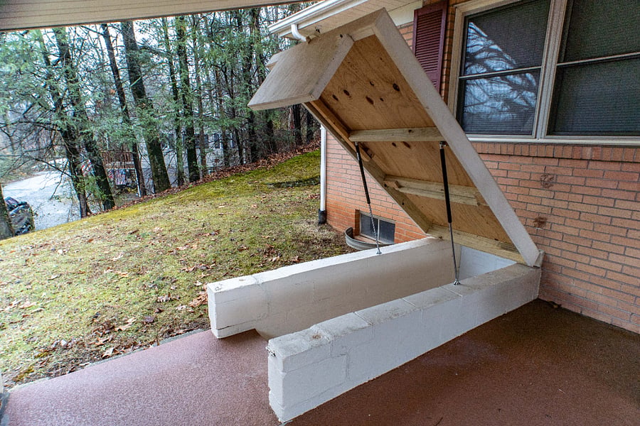 Basement stairwell, with cover open. Cover is on hydraulic lifters to make it easier to open and close.