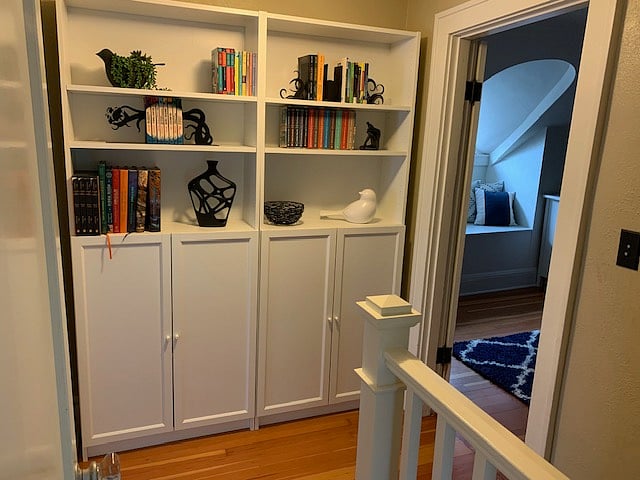 Bookshelves at top of stairs.
