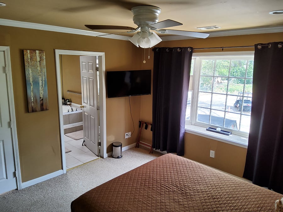 Smart Television in bedrooms ready for movie binging on day off.