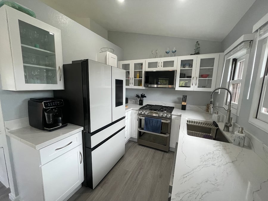 New high end appliances, gas cooking, new Samsung smart fridge, new high end dishwasher and quartz counter tops