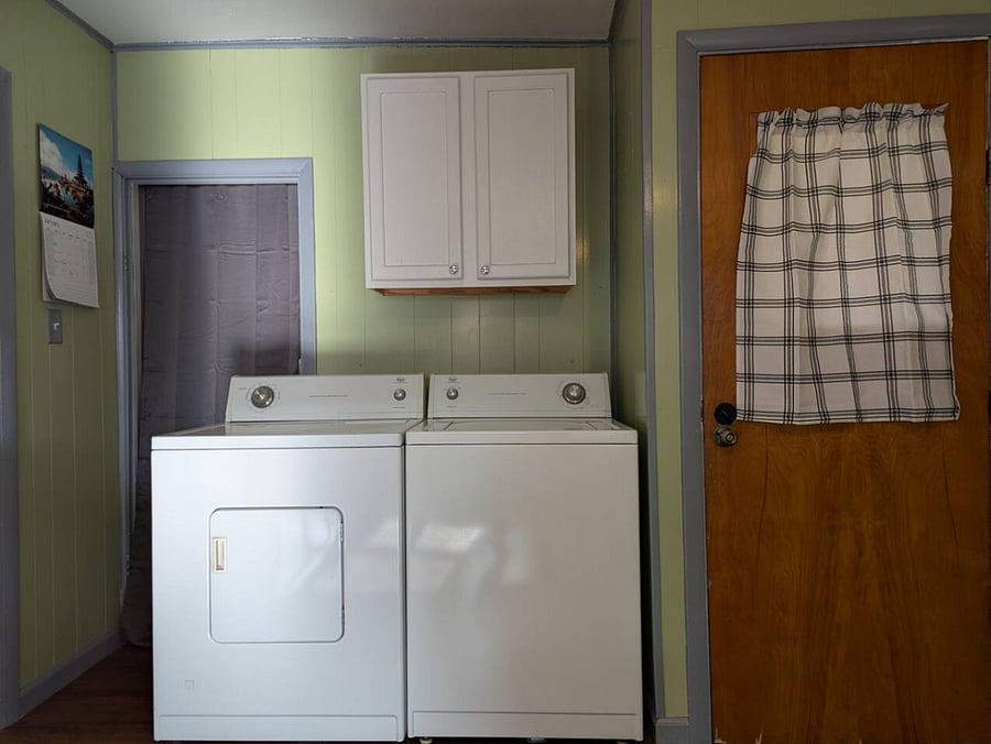 Washer and dryer located in the kitchen.