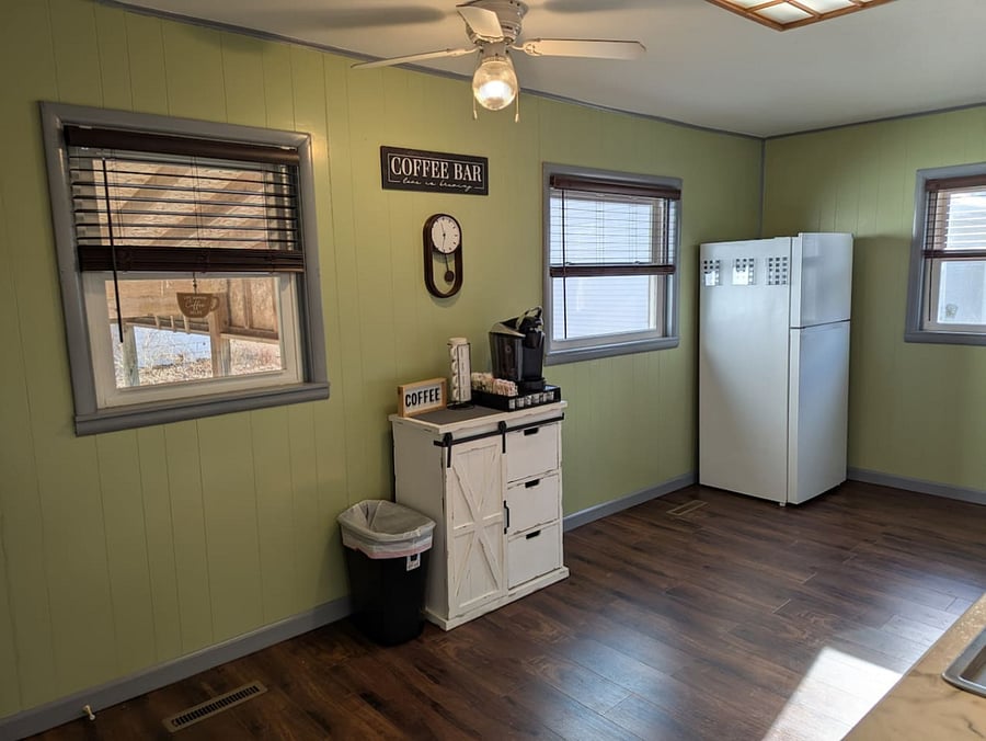 Coffee station and refrigerator in the kitchen.