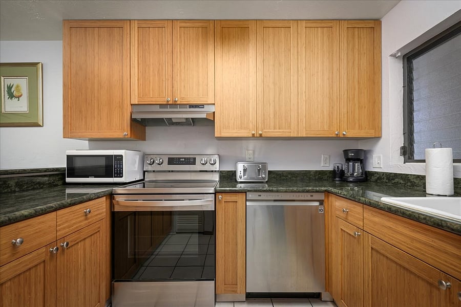 Newly renovated kitchen with stainless steel appliances, dishwasher, fridge, bamboo cabinets, marble counter tops, and all the cooking supplies you need to create a feast!