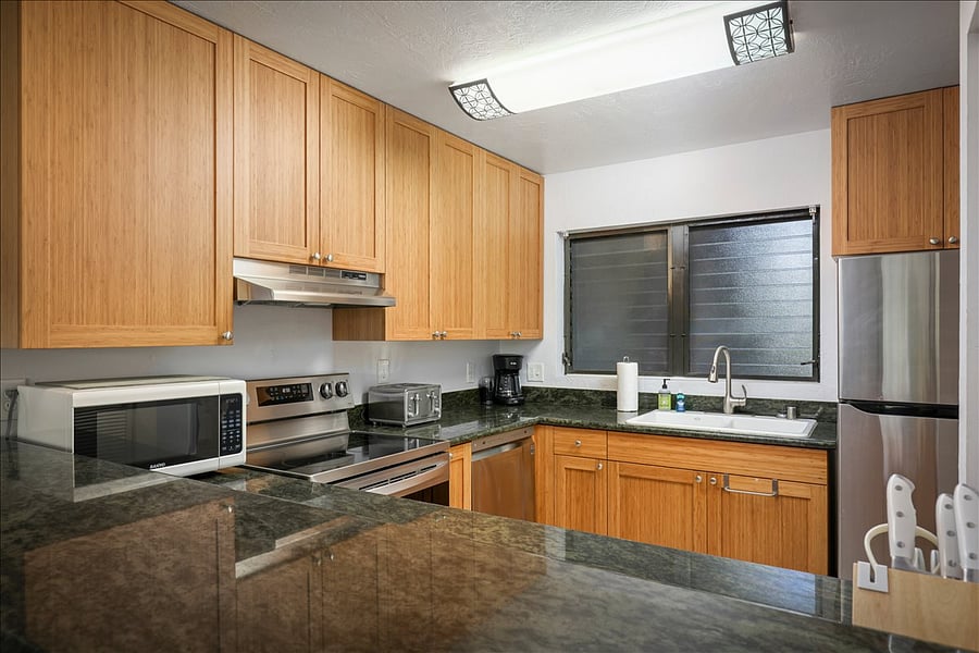 Newly renovated kitchen with stainless steel appliances, dishwasher, fridge, bamboo cabinets, marble counter tops, and all the cooking supplies you need to create a feast! Open style kitchen.