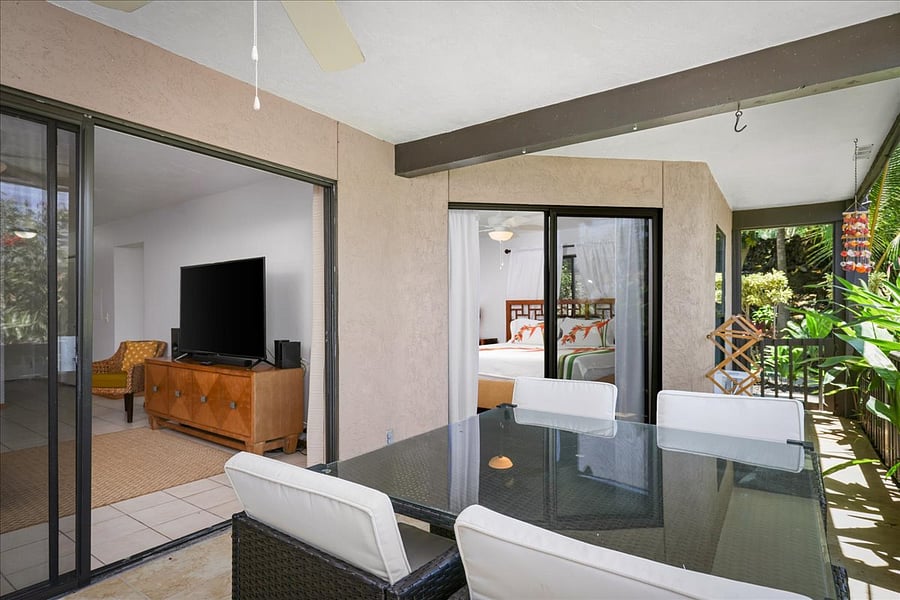 Exit directly into garden leading to pool area and grassy back yard in a few steps. Towel & bathing suit drying rack & hose to wash off sand before entering the home if needed.