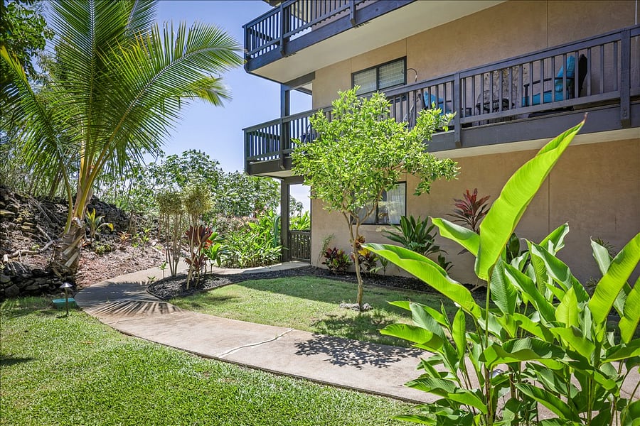 Grassy backyard right outside, step-free from street to your back private lanai (patio) & pool