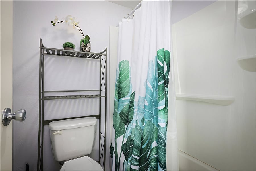 Full-size bathtub & shower in private master bathroom.