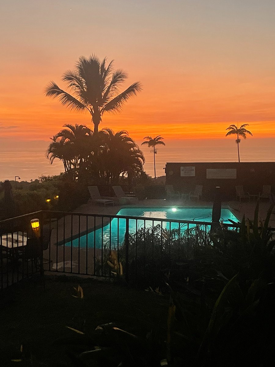 View from unit of pool at night. Very romantic with the solar powered torches. Honestly the pool is rarely occupied, and cleaned regularly by maintenance crew. There is a light out by the grill.
