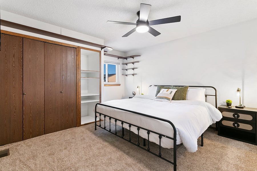 2nd Upstairs Bedroom with King Size Bed, Smart TV, plenty of closet space, and shared hallway bathroom. 
