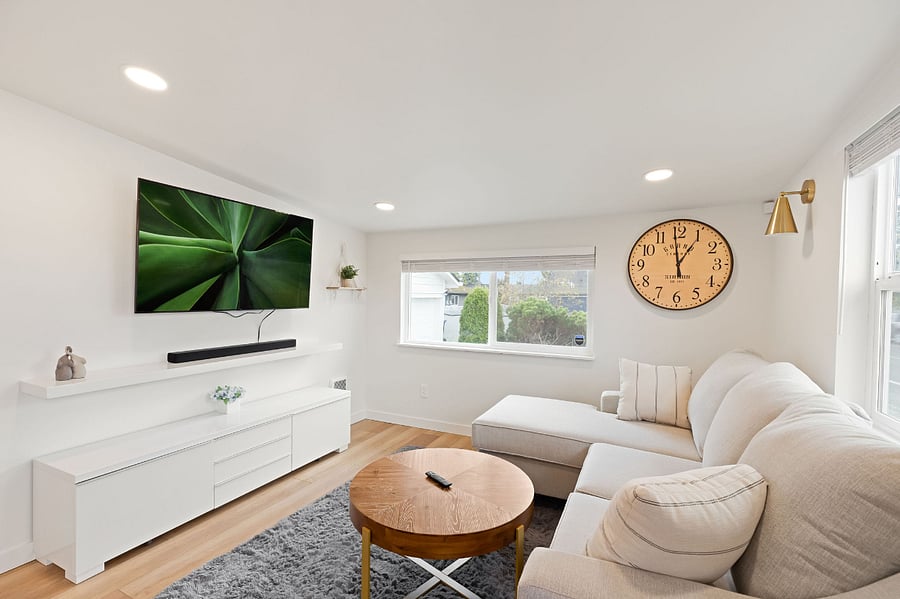 Smart TV in living room comes with Netflix, Peacock, and Apple TV, at no additional cost.