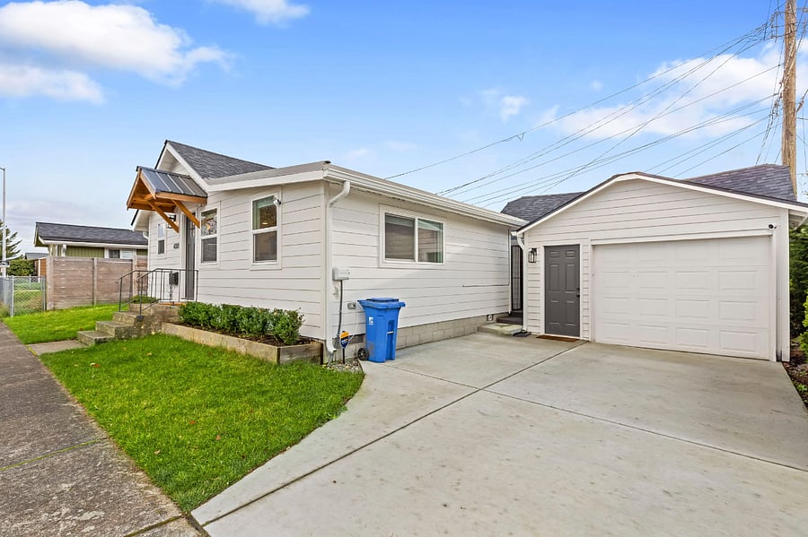 Garage can fit a mid-sized car, and driveway can fit a large-sized car.