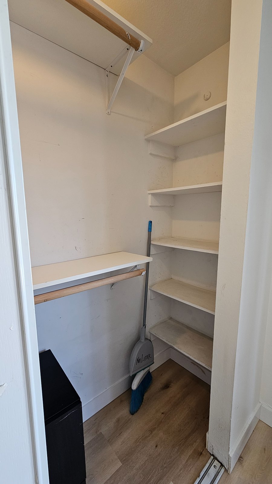 Large closet with tons of storage shelves to organize your clothes, shoes and luggage!
