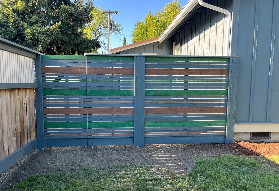 New fence with gate access from the backyard to the front, also a sunny place to sit behind.