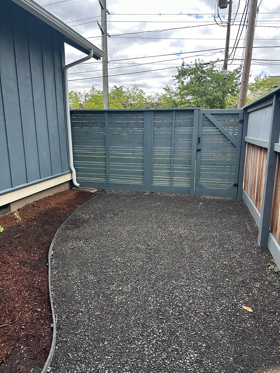 Inside the backyard with new fence and gate to allow access to front yard.