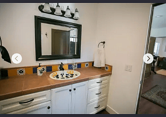 Two rooms with a full shower/bath, bidet toilet, large sink and roomy counter top